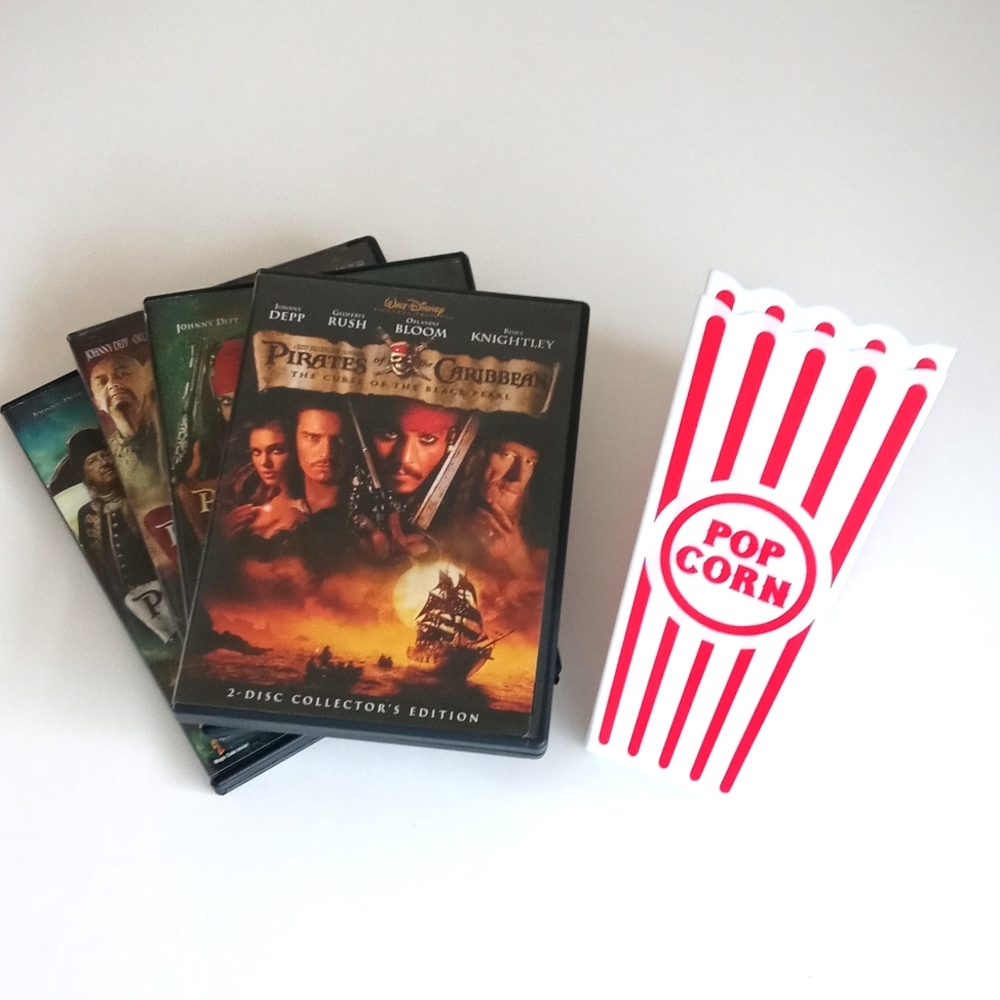 Set of 4 Pirates Of The Caribbean DVDS with Set of 2 New Popcorn Containers